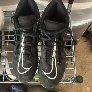 Nike high-top football cleats. 9.5 wide